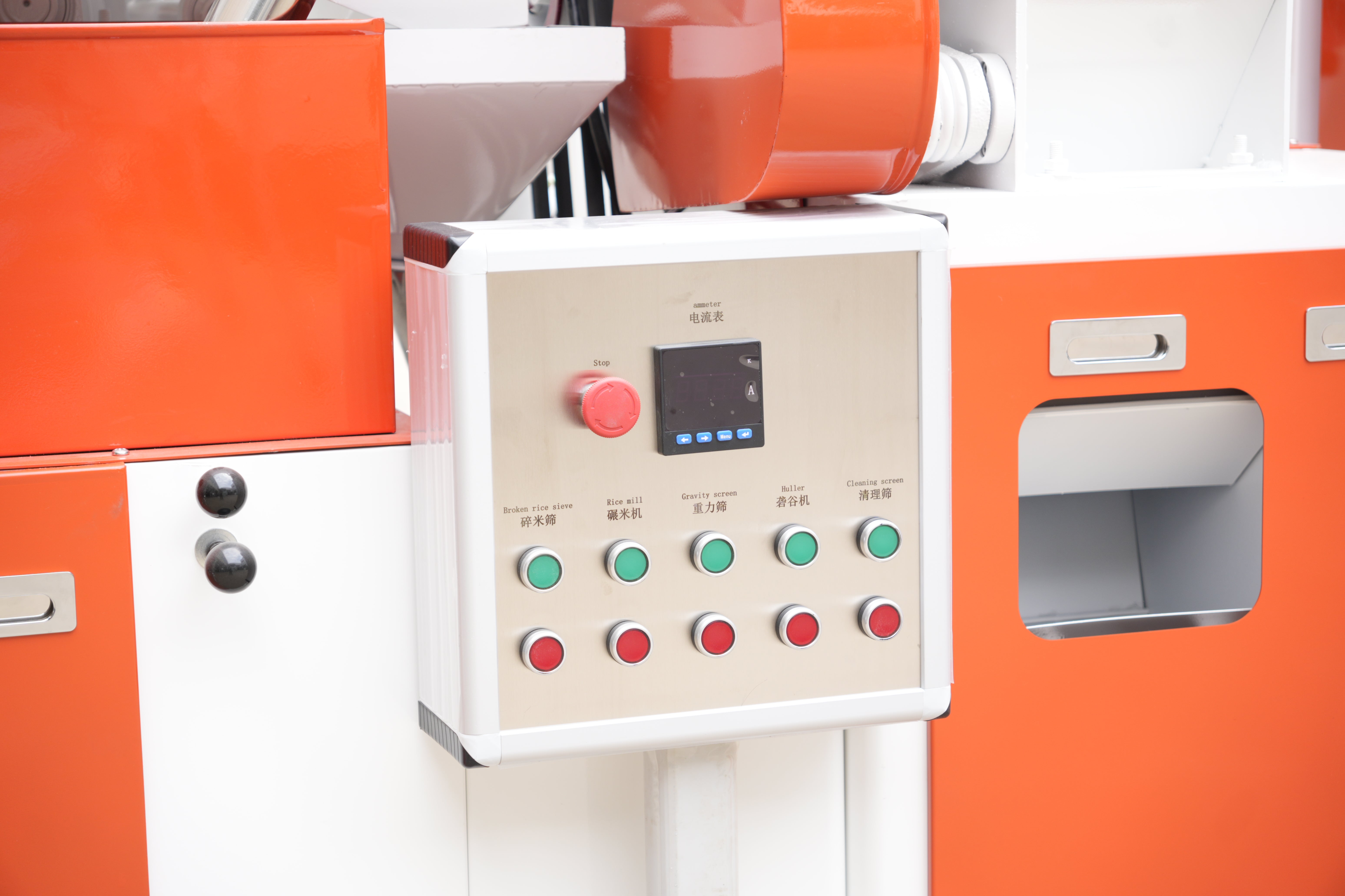 Control panel with buttons and display on an orange machine